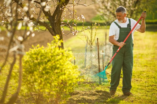 Gardener maintaining a townhouse lawn in Covent Garden